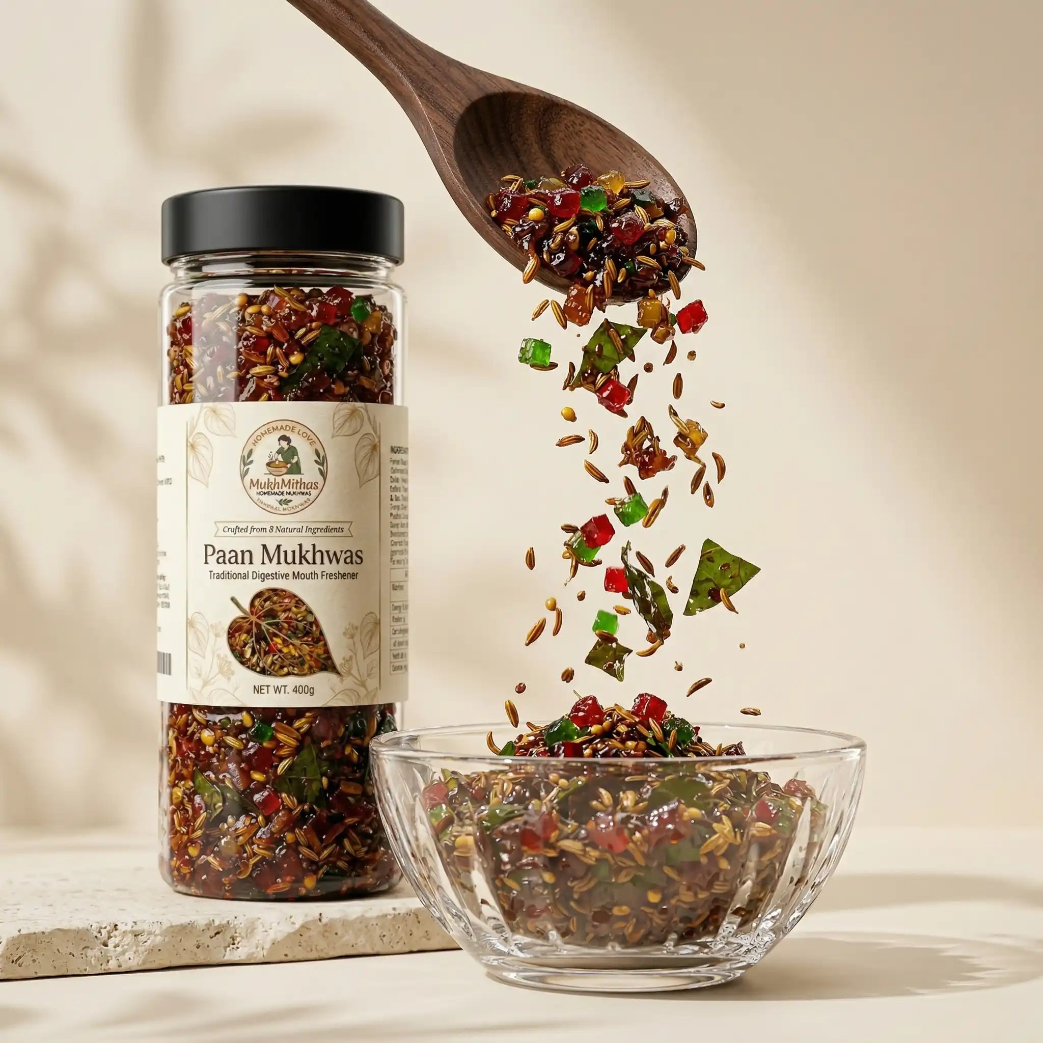 Jar of Paan Mukhwas with a wooden spoon and bowl on a beige background